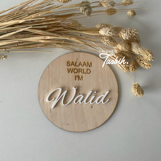 Wood birth sign 'Salaam world'